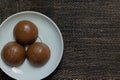 Honey bread cookie, typical Brazilian candy with cup of coffee on wooden background