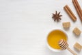 Honey, brown sugar and star anise with cinnamon on light background. Copy space for text. Royalty Free Stock Photo