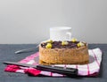 honey cake with edible bees on top on a dark table. concept for birthday, meeting with parents, holidays.