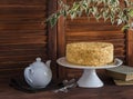 Honey cake, tea set, old books, flower Royalty Free Stock Photo