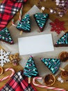 Honey cakes decorated as Christmas trees and New year attributes are framing empty place for a text Royalty Free Stock Photo