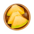 Honey Cantaloupe melon slices, ready-to-eat pieces in wooden bowl