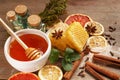 Honey, cinnamon and dried fruits on a wooden table. Healthy eating