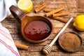 Honey and cinnamon on a wooden table Royalty Free Stock Photo