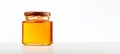 Honey in a clear jar sealed with a cap, soft lighting. Glass jar of golden honey. Concept of pure sweetness, healthy