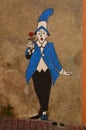 Man in blue and black suit with red rose, street Art Spain