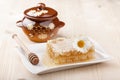 Honey comb and honey pot Royalty Free Stock Photo