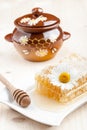 Honey comb and honey pot Royalty Free Stock Photo