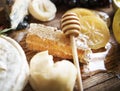 Honey comb and honey stick on the wooden table Royalty Free Stock Photo