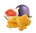 Honey comb slice and purple fig isolated on white background Royalty Free Stock Photo