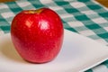 Honey Crisp apple on a white plate