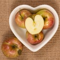 Honey Crisp Apples in a Heart Shaped Bowl Royalty Free Stock Photo