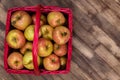 Honey Crisp Apples in a Red Wicker Basket Royalty Free Stock Photo