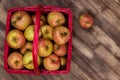 Honey Crisp Apples in a Red Wicker Basket Royalty Free Stock Photo