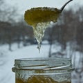 Honey in crystallization stage. No longer a continuous jet is formed.