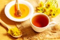 honey with dandelions. cup of tea with dandelion. selective focus Royalty Free Stock Photo