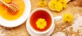 Honey with dandelions. cup of tea with dandelion. selective focus Royalty Free Stock Photo