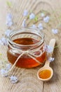 Honey decorated with forget-me-not flowers