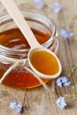 Honey decorated with spring flowers Royalty Free Stock Photo