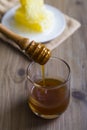 Honey dipper dripping with honey Royalty Free Stock Photo