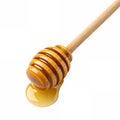 A honey dipper with honey dripping Royalty Free Stock Photo