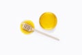 Honey dipper and honey in glass bowl on light grey background. Honey stains. View top Royalty Free Stock Photo