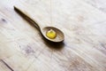 Honey driping into wooden spoon Royalty Free Stock Photo