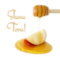 honey dripping on apple isolated on a white. Rosh hashanah & x28;jewish New Year holiday& x29; concept