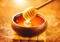 Honey dripping from honey dipper in wooden bowl. Healthy organic thick honey pouring from the wooden honey spoon Royalty Free Stock Photo