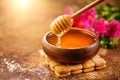 Honey dripping from honey dipper in wooden bowl.  Close-up. Healthy organic Thick honey dipping from the wooden honey spoon Royalty Free Stock Photo