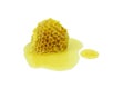 Honey dripping with honeycomb isolated on a white background, concept of bee products Royalty Free Stock Photo