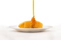 Honey Dripping on Honeycomb, Isolated on White Background Royalty Free Stock Photo