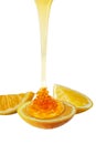 Honey dripping on the lemon slice Royalty Free Stock Photo