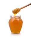 Honey drops from drizzler Royalty Free Stock Photo