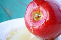 Honey drops over red apple - Rosh HaShanah Jewish New Year