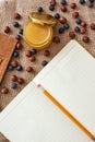 Honey, dry berries and cookbook on the table