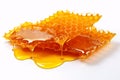 Honeycomb with honey drop on white background Royalty Free Stock Photo