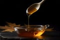honey flowing down to silver spoon. natural food. sweet desert honey. transparent food. sweet syrup studio light tasty food. Royalty Free Stock Photo