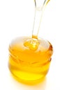 Honey flowing isolated on white background. Royalty Free Stock Photo