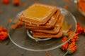 The honey on baked goods. Orange calendula flower tea Royalty Free Stock Photo