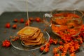 The honey on baked goods. Orange calendula flower tea Royalty Free Stock Photo