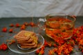 The honey on baked goods. Orange calendula flower tea Royalty Free Stock Photo