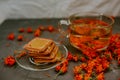 The honey on baked goods. Orange calendula flower tea Royalty Free Stock Photo