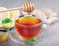 Honey, ginger, lemon and cup of tea on the wooden table. cold and flu remedy. close up. Royalty Free Stock Photo