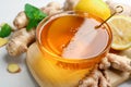 Honey, ginger and lemon on white table, closeup. Natural cold remedies Royalty Free Stock Photo