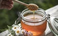 Honey in glass jar with bee flying and flowers on a wooden floor Royalty Free Stock Photo