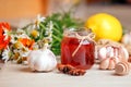 Honey in a glass jar with camomile calendula flowers, ginger root, garlic, anise - immunity tea ingredients, seasonal concept of