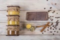 Honey in a glass jar on a light wooden background with a chalkboard ÃÂ¡halk board