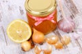 Honey in glass jar, onion, lemon and garlic, healthy nutrition and strengthening immunity Royalty Free Stock Photo