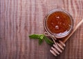 Honey in a glass jar on the wooden table, top view Royalty Free Stock Photo